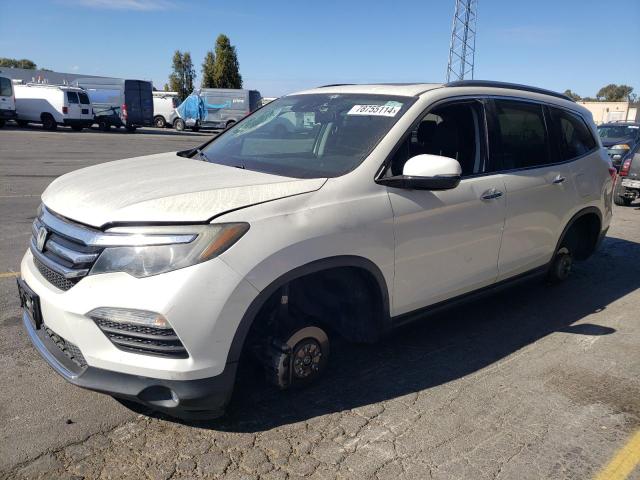 HONDA PILOT TOUR 2017 with VIN 5FNYF6H9XHB074630 - Photo from auction