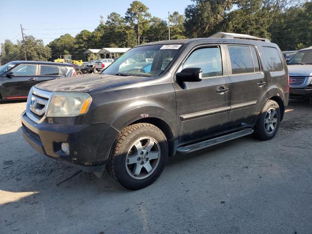 HONDA PILOT TOUR 2011 with VIN 5FNYF4H92BB062483 - Photo from auction