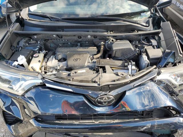 Photo 12 from auction – 2018 TOYOTA RAV4 LE with VIN JTMBFREV7JJ235393