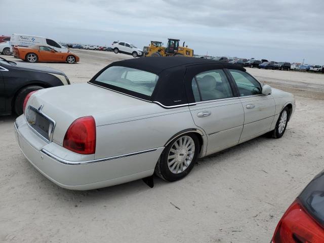 Photo 3 from auction – 2004 LINCOLN TOWN CAR E with VIN 1LNHM81W94Y677804