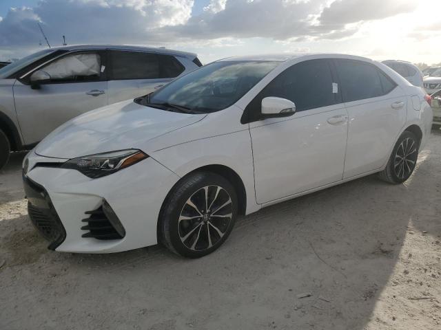 TOYOTA COROLLA L 2018 with VIN 5YFBURHE2JP824509 - Photo from auction