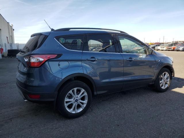Photo 3 from auction – 2018 FORD ESCAPE SE with VIN 1FMCU9GD9JUC19639