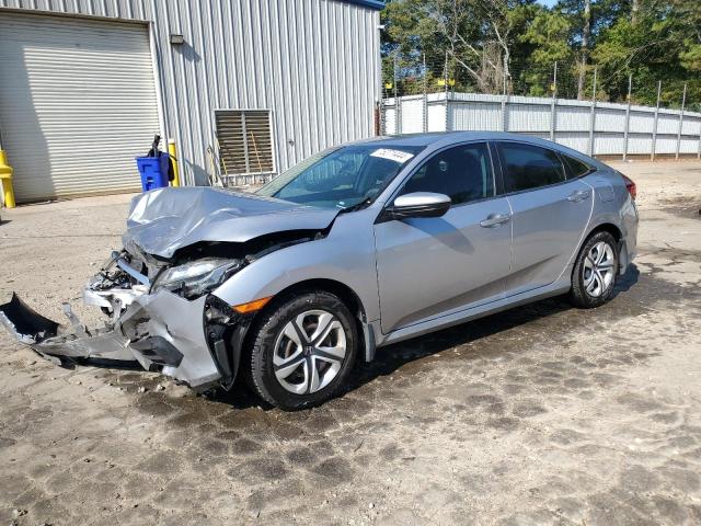 HONDA CIVIC LX 2018 with VIN 19XFC2F55JE030877 - Photo from auction