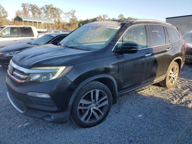 Photo 1 from auction – 2017 HONDA PILOT TOUR with VIN 5FNYF6H95HB014268