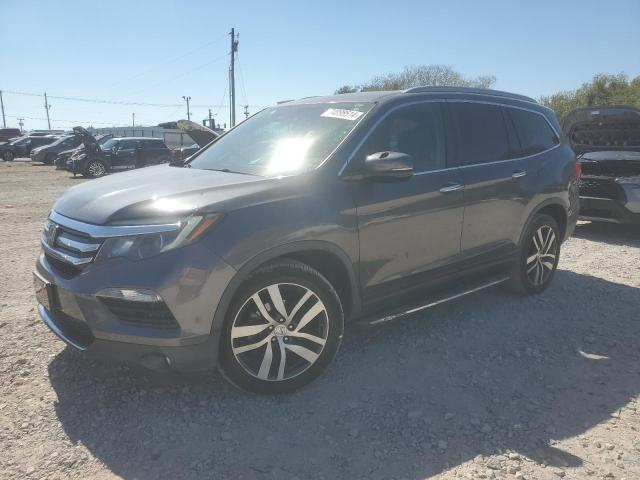 HONDA PILOT ELIT 2016 with VIN 5FNYF6H09GB116916 - Photo from auction