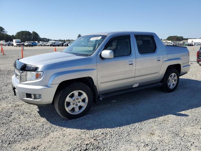 HONDA RIDGELINE 2011 with VIN 5FPYK1F46BB002232 - Photo from auction