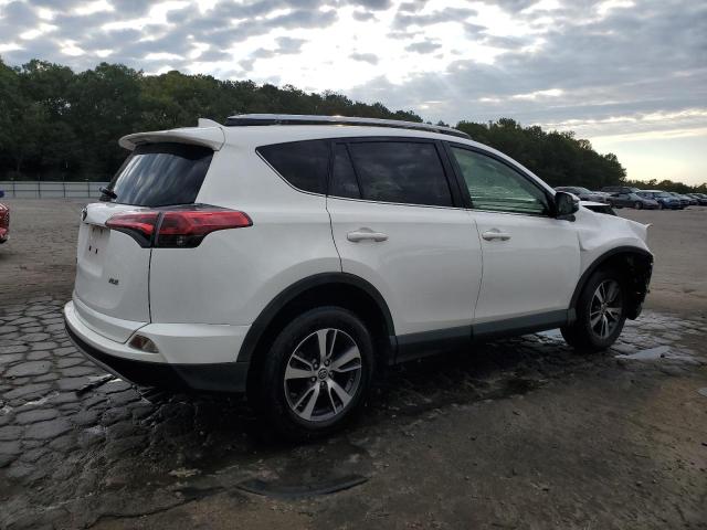 Photo 3 from auction – 2017 TOYOTA RAV4 XLE with VIN JTMWFREV5HJ115443