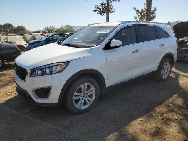 KIA SORENTO LX 2016 with VIN 5XYPG4A34GG174846 - Photo from auction