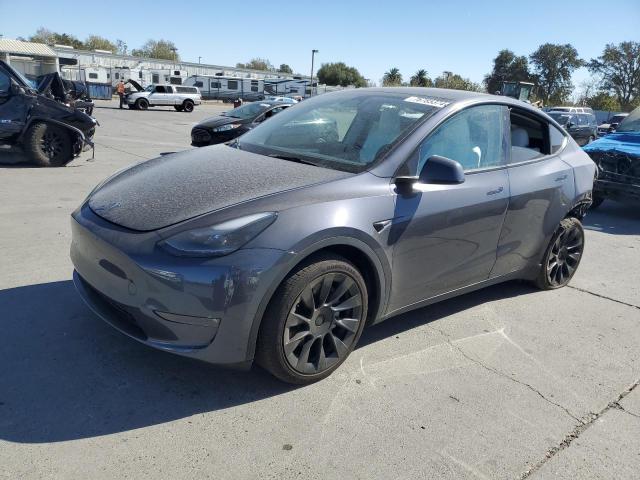 TESLA MODEL Y 2023 with VIN 7SAYGAEE0PF696057 - Photo from auction