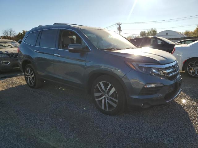 Photo 4 from auction – 2018 HONDA PILOT ELIT with VIN 5FNYF6H02JB041872
