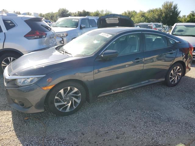 HONDA CIVIC EX 2018 with VIN 19XFC2F89JE028429 - Photo from auction