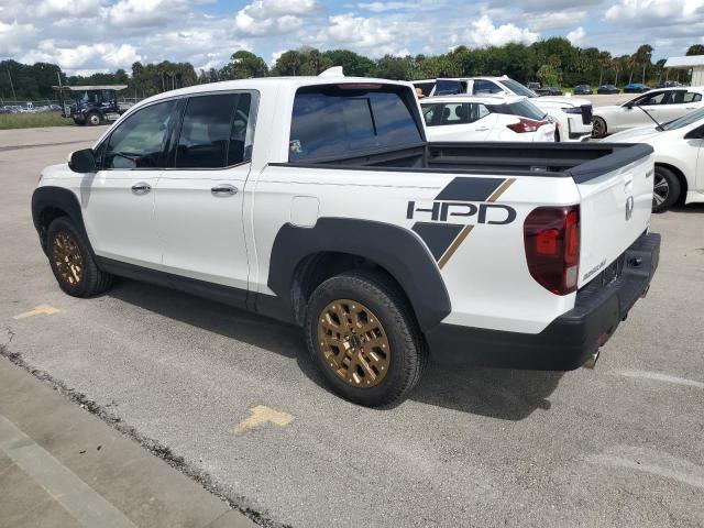 Photo 2 from auction – 2022 HONDA RIDGELINE with VIN 5FPYK3F76NB013189
