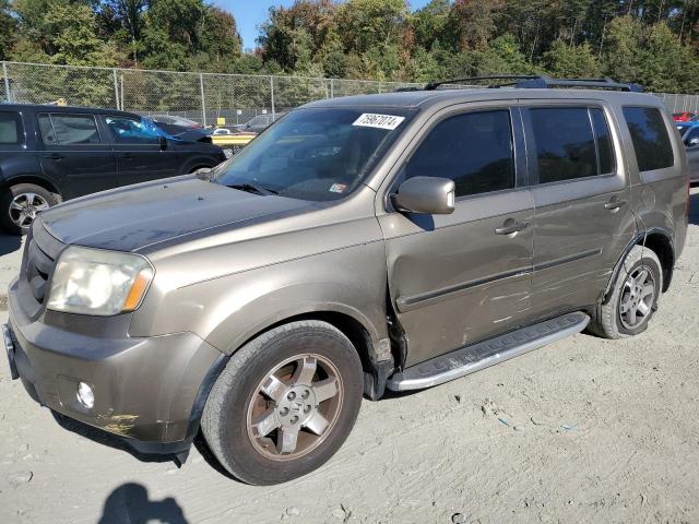 HONDA PILOT TOUR 2011 with VIN 5FNYF4H95BB042146 - Photo from auction