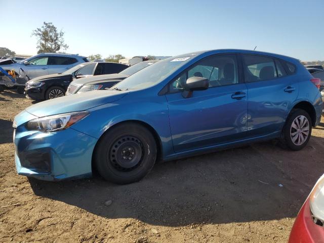 SUBARU IMPREZA 2019 with VIN 4S3GTAA67K3741942 - Photo from auction