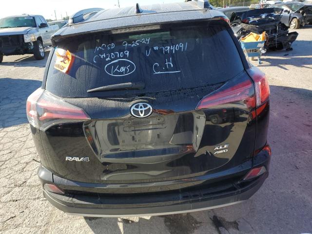 Photo 6 from auction – 2018 TOYOTA RAV4 XLE with VIN 2T3RFREV2JW794091