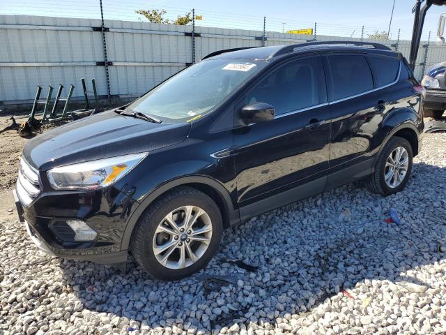 FORD ESCAPE SE 2018 with VIN 1FMCU9GD5JUC11523 - Photo from auction