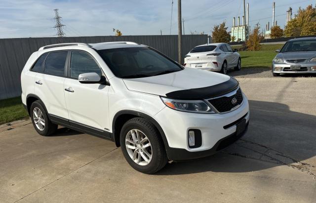 KIA SORENTO LX 2014 with VIN 5XYKTDA71EG477797 - Photo from auction