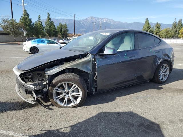 TESLA MODEL Y 2022 with VIN 7SAYGAEE8NF409285 - Photo from auction