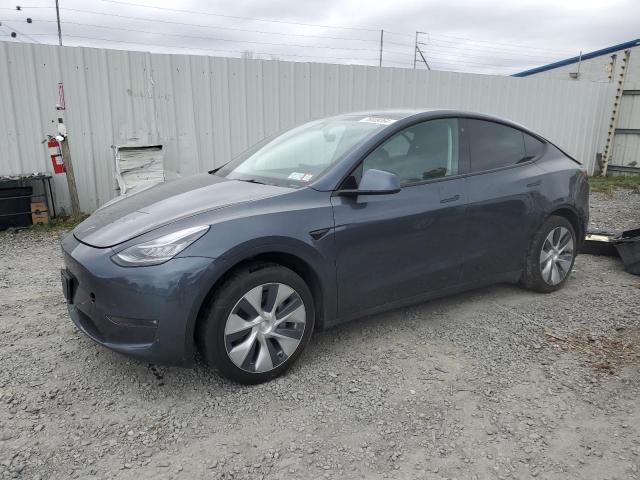 TESLA MODEL Y 2023 with VIN 7SAYGDEE1PF614001 - Photo from auction