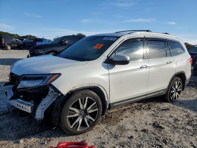 HONDA PILOT TOUR 2022 with VIN 5FNYF6H64NB038529 - Photo from auction