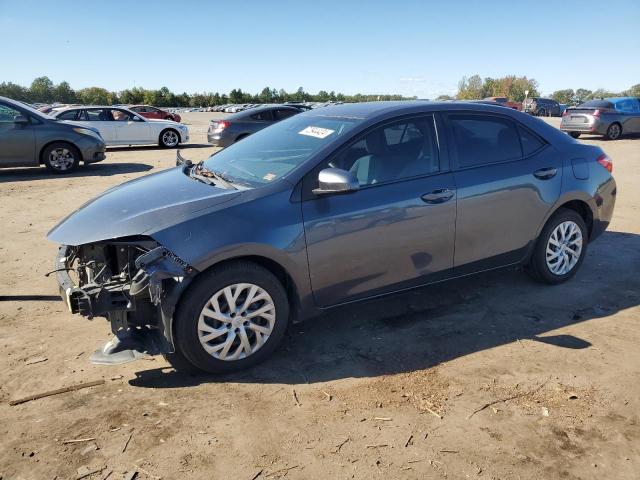 TOYOTA COROLLA L 2017 with VIN 5YFBURHE5HP699967 - Photo from auction