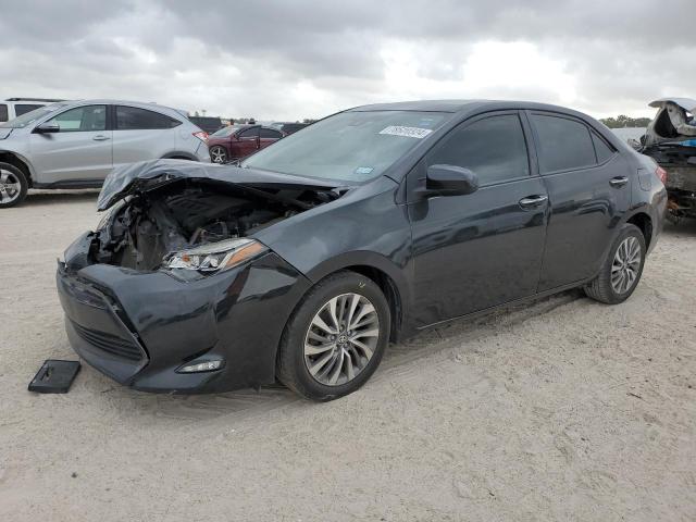 TOYOTA COROLLA L 2017 with VIN 5YFBURHE1HP615580 - Photo from auction