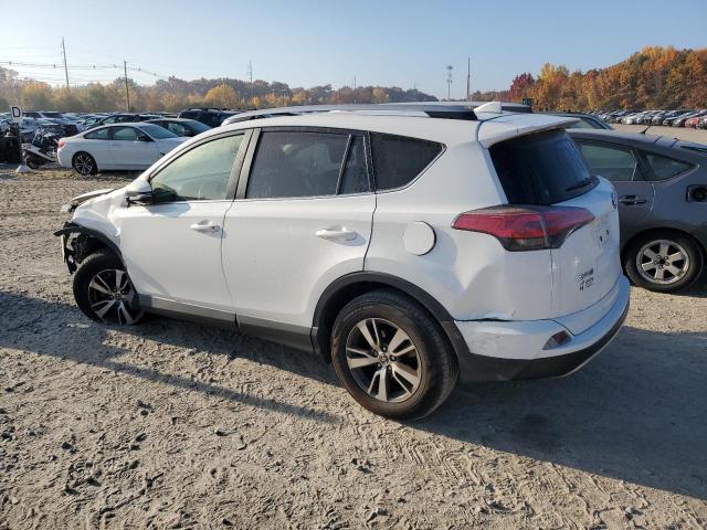 Photo 2 from auction – 2017 TOYOTA RAV4 XLE with VIN JTMRFREV9HJ714519