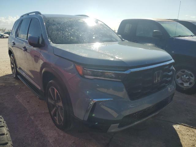 Photo 4 from auction – 2023 HONDA PILOT TOUR with VIN 5FNYG2H72PB003263