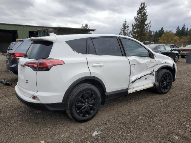 Photo 3 from auction – 2018 TOYOTA RAV4 LE with VIN 2T3BFREV9JW809574