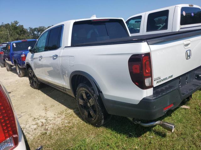 Photo 2 from auction – 2022 HONDA RIDGELINE with VIN 5FPYK3F77NB022290