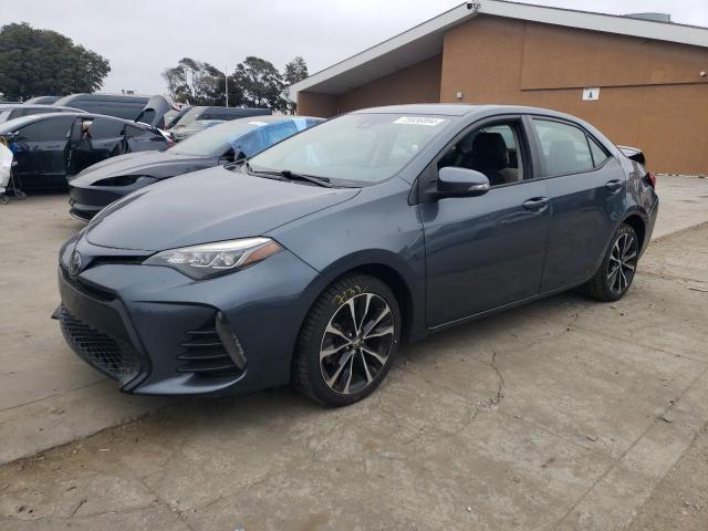 TOYOTA COROLLA L 2018 with VIN 2T1BURHE8JC989268 - Photo from auction