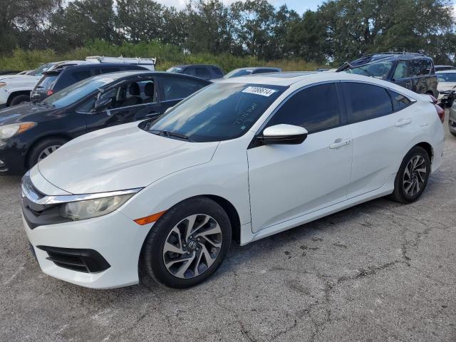 HONDA CIVIC EX 2018 with VIN 19XFC2F75JE002174 - Photo from auction