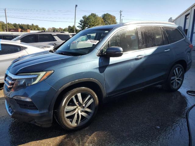HONDA PILOT TOUR 2016 with VIN 5FNYF5H90GB023002 - Photo from auction