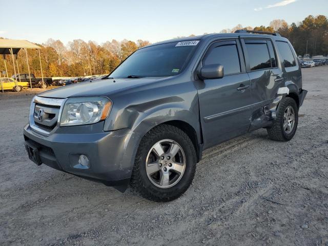 HONDA PILOT EXL 2011 with VIN 5FNYF4H52BB078812 - Photo from auction