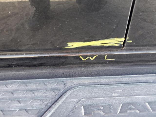 Photo 12 from auction – 2023 RAM 1500 LARAM with VIN 1C6SRFJM9PN556850