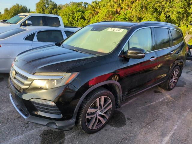 HONDA PILOT ELIT 2017 with VIN 5FNYF6H07HB067734 - Photo from auction