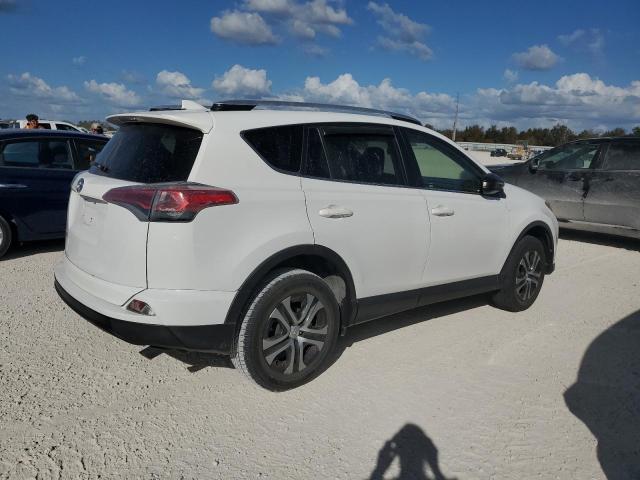 Photo 3 from auction – 2016 TOYOTA RAV4 LE with VIN JTMZFREV3GJ067436