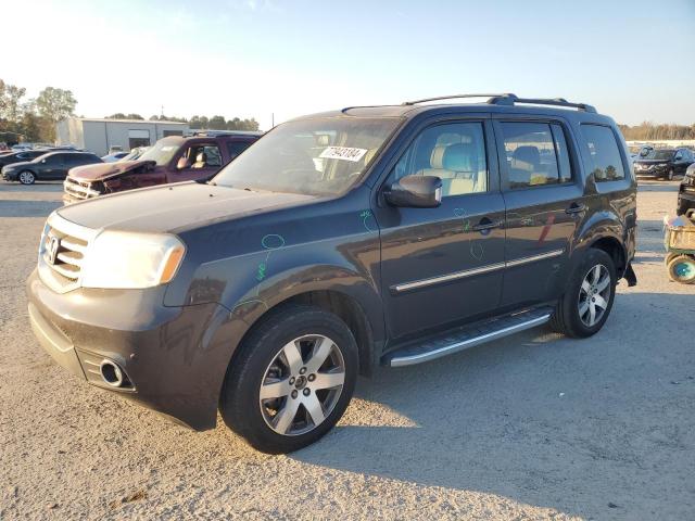 HONDA PILOT TOUR 2015 with VIN 5FNYF4H94FB044749 - Photo from auction