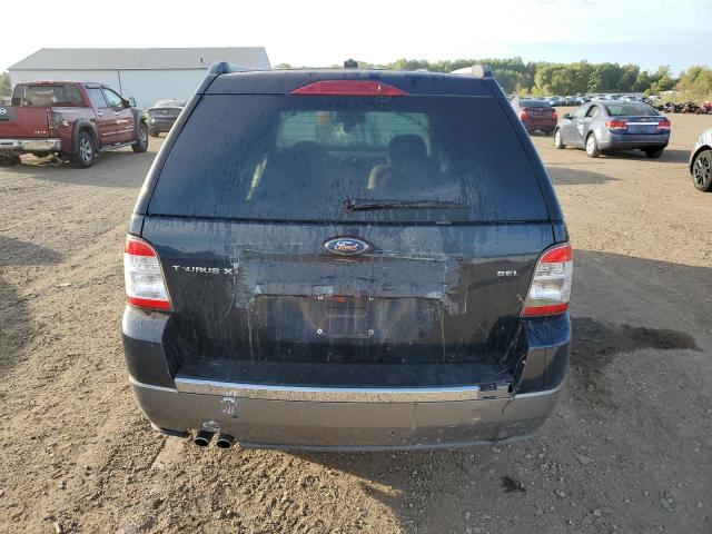 Photo 6 from auction – 2008 FORD TAURUS X S with VIN 1FMDK02W18GA30474