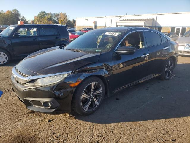 HONDA CIVIC TOUR 2016 with VIN 2HGFC1F98GH648478 - Photo from auction