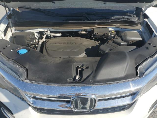 Photo 12 from auction – 2021 HONDA PILOT ELIT with VIN 5FNYF6H00MB047254
