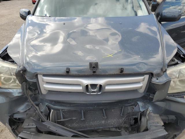 Photo 12 from auction – 2006 HONDA PILOT EX with VIN 2HKYF18636H003129