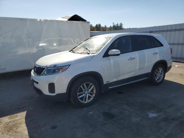KIA SORENTO LX 2015 with VIN 5XYKTCA69FG569890 - Photo from auction