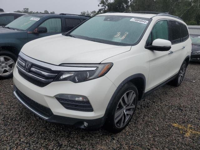 HONDA PILOT TOUR 2017 with VIN 5FNYF6H90HB035688 - Photo from auction