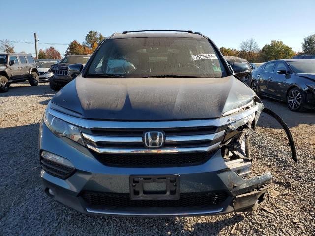 Photo 5 from auction – 2018 HONDA PILOT ELIT with VIN 5FNYF6H02JB041872