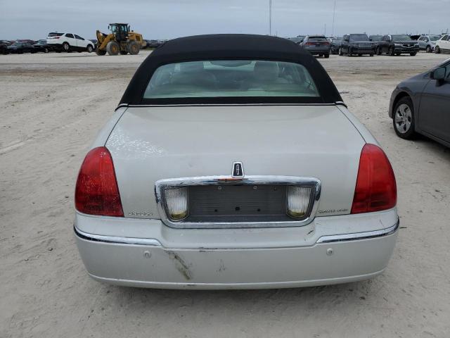 Photo 6 from auction – 2004 LINCOLN TOWN CAR E with VIN 1LNHM81W94Y677804