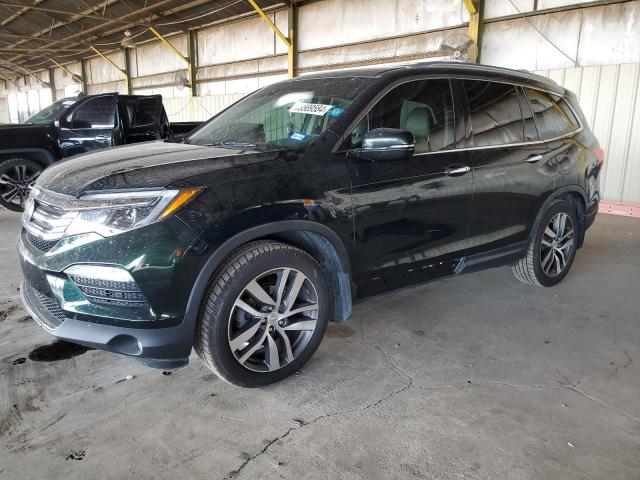 HONDA PILOT TOUR 2016 with VIN 5FNYF5H96GB001991 - Photo from auction