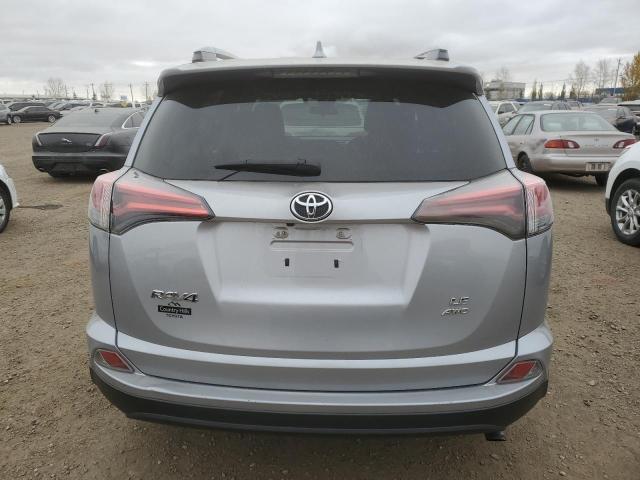 Photo 6 from auction – 2018 TOYOTA RAV4 LE with VIN 2T3BFREV0JW735090