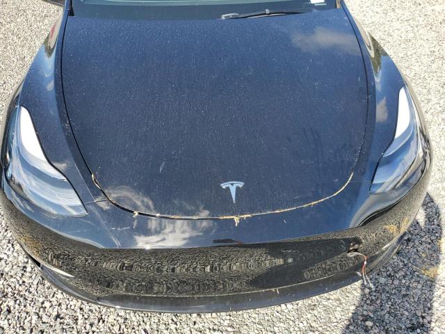 Photo 11 from auction – 2023 TESLA MODEL Y with VIN 7SAYGDEE0PA181512