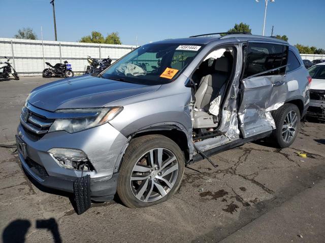 HONDA PILOT TOUR 2016 with VIN 5FNYF6H94GB092944 - Photo from auction